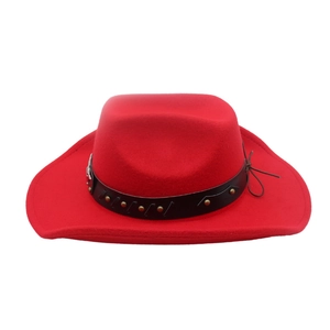 Detail of red felt cowboy hat with black leather band and metallic silver studs