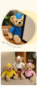 Detail of plush teddy bears in colorful hoodies and caps in a cozy home setting
