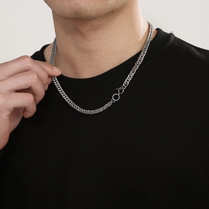 Silver stainless steel Cuban chain necklace with OT clasp detail shown on a neck