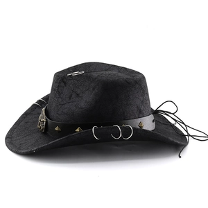 Detail of western cowboy hat with bull head buckle and gold pyramid studs on black band