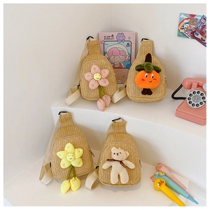 Detail of four colorful handmade woven crossbody bags for kids with cute cartoon bear motifs