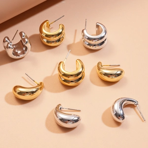 Minimalist double C-shape and teardrop stud earrings in gold and silver metal finishes