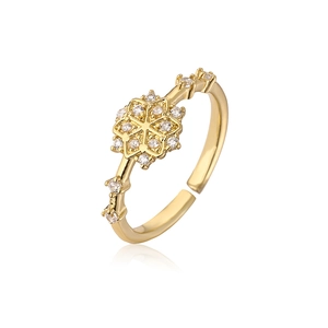 Macro shot of gold-plated snowflake ring featuring sparkling white cubic zirconia stones