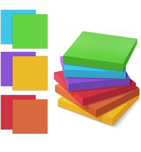 Macro view of multi-colored sticky notes stacked to show thickness and vibrant paper colors