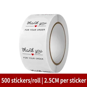 Detail of 2.5cm round white thank you stickers with red heart for gift sealing