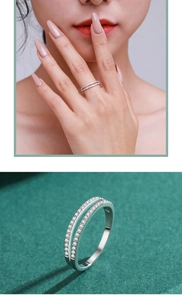 Macro detail of a double-layered s925 silver ring featuring small clear sparkling zircon stones