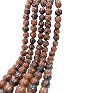 Strands of natural mahogany obsidian round beads with reddish-brown polished finish