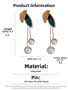 Detailed view of pearl tassel earrings with size dimensions 5.3cm x 1.4cm and weight 9.5g