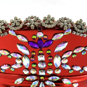 Macro shot of red nautical hat featuring colorful rhinestones and sparkling gems