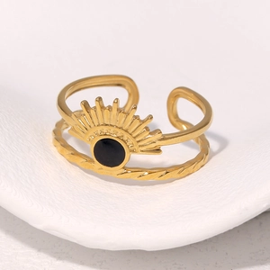 Detail of 18k gold plated stainless steel double layer ring with sunburst sun disk design