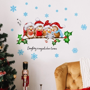 Christmas wall stickers with robins on holly branches and blue snowflakes on white wall