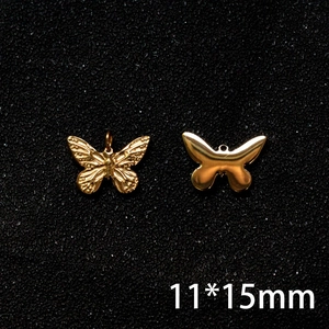 Detail view of 11x15mm golden butterfly charms with embossed texture and sleek silhouette