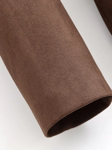 Macro shot of coffee brown suede coat cuff showing soft texture and premium stitching