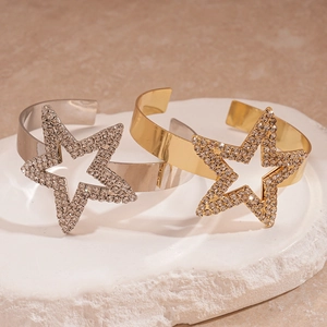 Luxury gold and silver star cuff bracelets with sparkling crystals on stone base