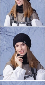 Detail of black winter knit beanie and neck warmer with thermal fleece and logo