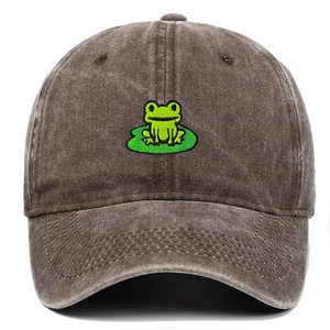 Close-up of high-quality frog and lotus leaf embroidery on vintage grey baseball cap