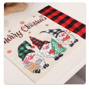 Linen Christmas gnome placemat featuring Merry Christmas text and red buffalo plaid edges
