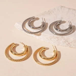 Double-layered textured C-shape hoop earrings in polished gold and silver metal finishes