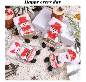 Detailed view of burlap Christmas stockings with 3D snowman, elk, and Santa Claus characters