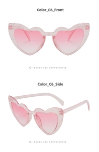 Detail of pink heart-shaped sunglasses with glitter resin frame and gradient lenses