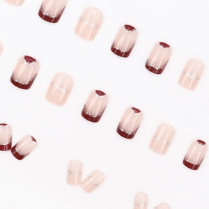 Short burgundy French glitter fake nails with minimalist nude design and silver lines