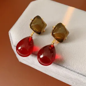 Retro resin drop earrings featuring square olive and red teardrop gems with gold frames