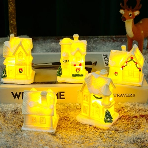 Set of 5 lighted Christmas resin house figurines with warm yellow LED lights for decor