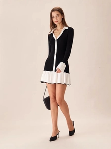 Contrast knit dress with V-neck, long sleeves and ruffle hem shown on model