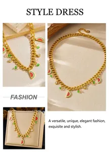 Detail of gold chain necklace featuring enamel watermelon slice and colorful beads charms