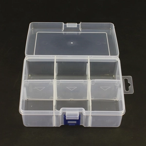 Detail view of transparent jewelry box with adjustable dividers and blue buckles