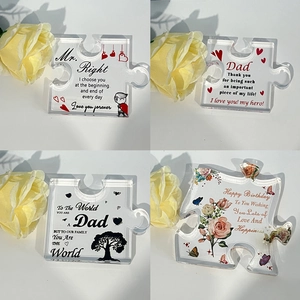 Detailed view of four acrylic puzzle gifts with unique English inscriptions for parents