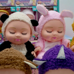 Close-up of 8-inch BJD dolls dressed in plush panda and unicorn animal costumes