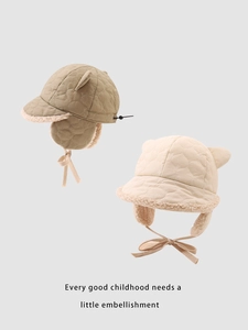 Detail of quilted winter trapper hats for kids with plush fleece lining and ear flaps