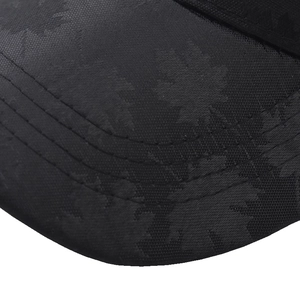 Black baseball cap with maple leaf jacquard pattern and premium stitching details