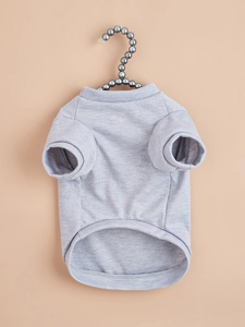 Detail of grey cotton pet T-shirt featuring curved hem and soft knit texture on hanger