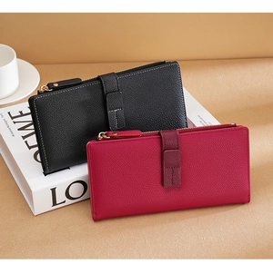 Detailed close-up of premium lychee grain leather wallets with sleek side zipper and buckle