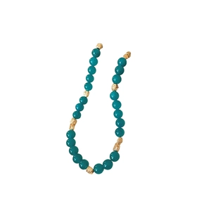 Handmade beaded necklace with teal stones and textured golden accent beads in vintage style