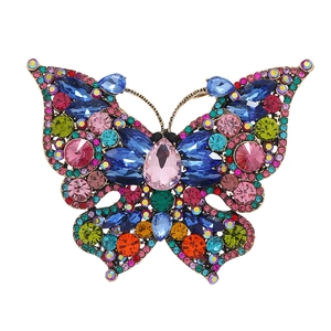 Vintage oversized butterfly brooch with colorful rhinestones on a clean white background