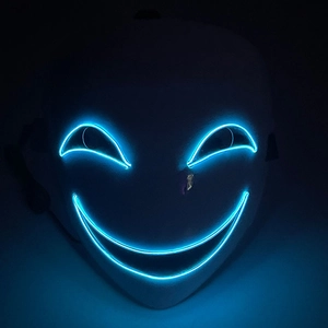 Macro view of ice blue LED lines on glowing full face mask for Halloween party costuming