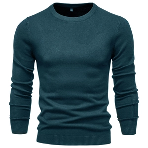 Detail of teal crew neck knit sweater showing ribbed collar and fine knit texture