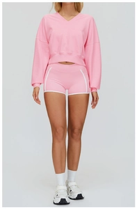 Front view of pink sports lounge set with V-neck sweatshirt and white-trimmed gym shorts