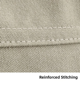 Detail shot of heavy-duty double stitching on beige canvas shoulder bag for durability