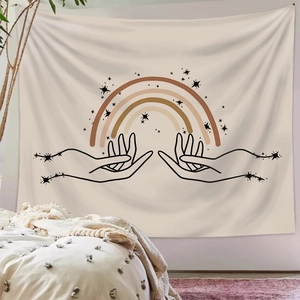 Bohemian wall tapestry with hands holding a rainbow and stars for bedroom decor