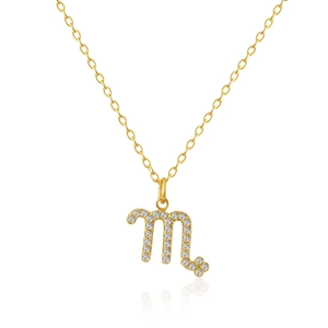 Detailed macro view of gold Scorpio zodiac pendant with sparkling zircon stones