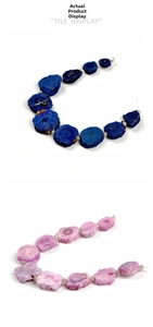 Macro detail of irregular raw crystal slices in deep blue and soft pink textures