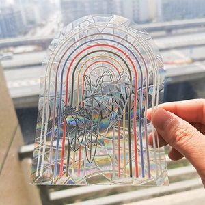 Rainbow arch and tropical leaf suncatcher sticker with holographic mosaic effect