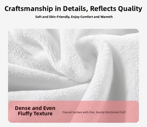 Close-up of soft white flannel blanket fabric showing thick plush texture and warm material