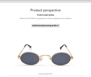 Front view of small vintage oval sunglasses with gold metal frame and dark grey lenses