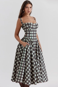 Detail of red and green plaid midi dress with a vintage-style corset bodice design