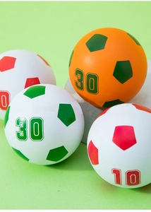 Detailed view of elastic mini foam soccer balls with number 10 and 30 on green background